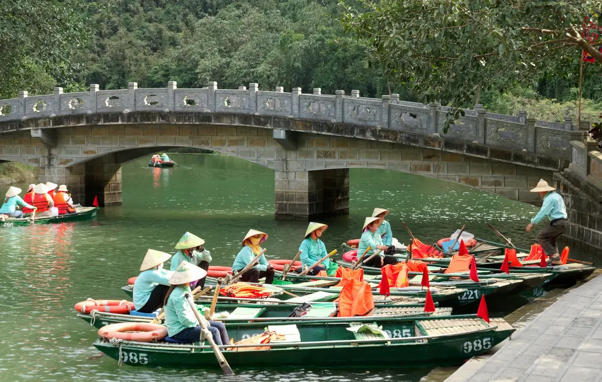 Tour boats at the Trang An wharf on a 3-Day Ninh Binh and Lan Ha Bay Cruise